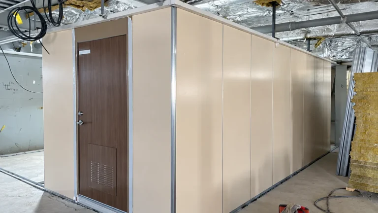 Hospital vessel interior wall panel and cabin door installation in progress